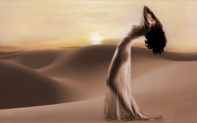 woman in desert at sunset