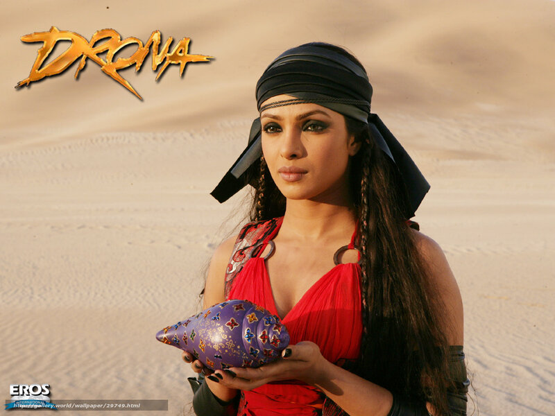 Woman in Desert Holding Shell