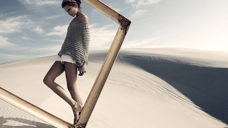 woman in desert with frame