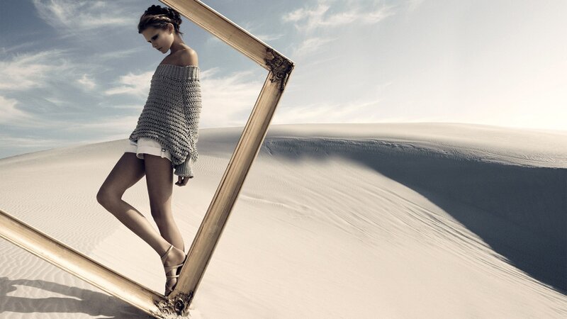 woman in desert with frame