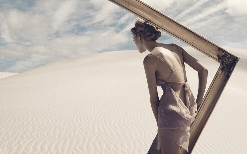 woman in desert with frame