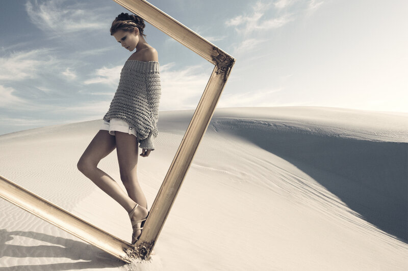 woman in desert with frame