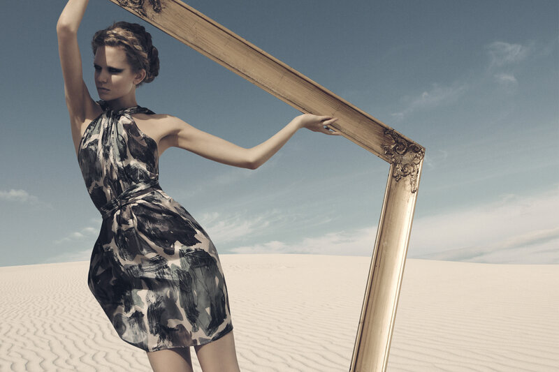 woman in desert with frame