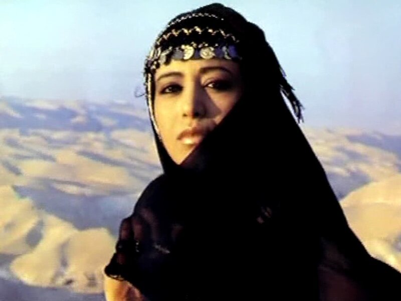 woman in desert with headscarf