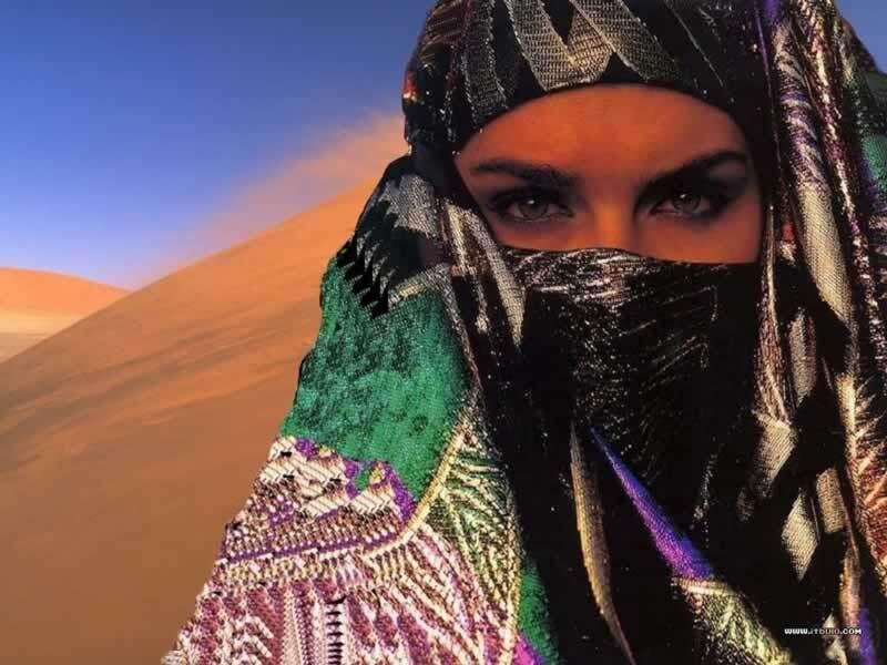 woman in desert with headscarf