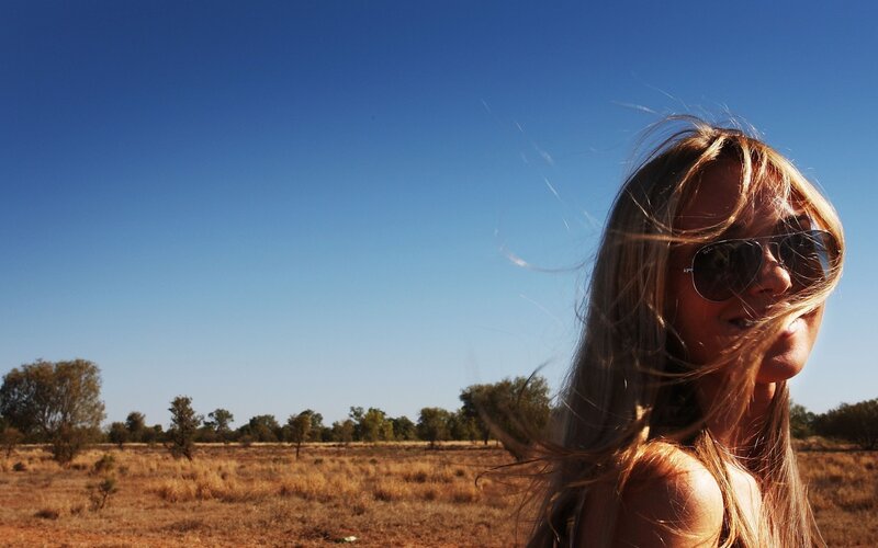 Woman in desert with sunglasses