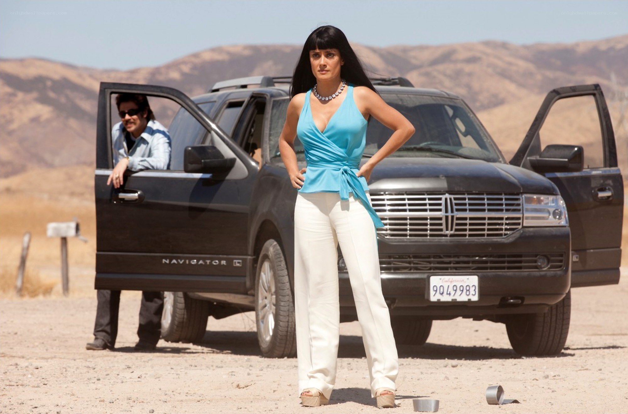 Woman in desert with SUV