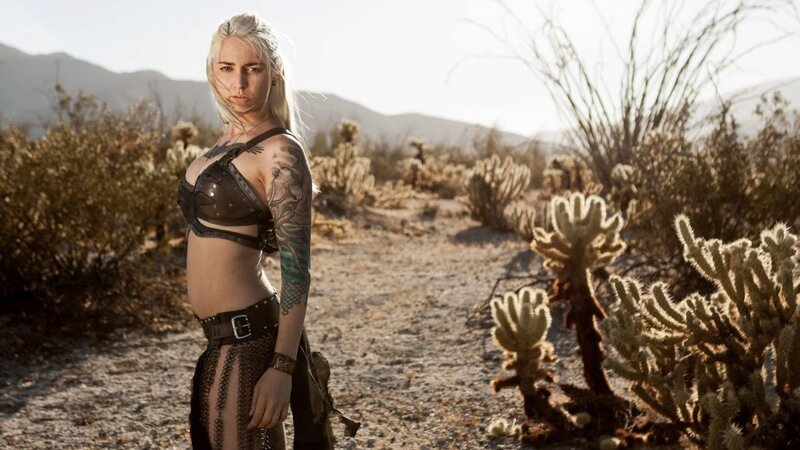 woman in desert with tattoos