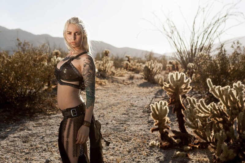 woman in desert with tattoos