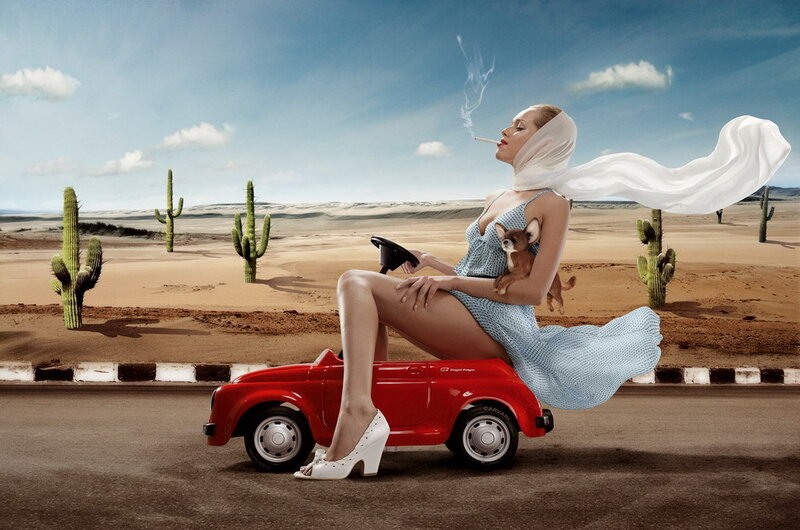 Woman in desert with toy car