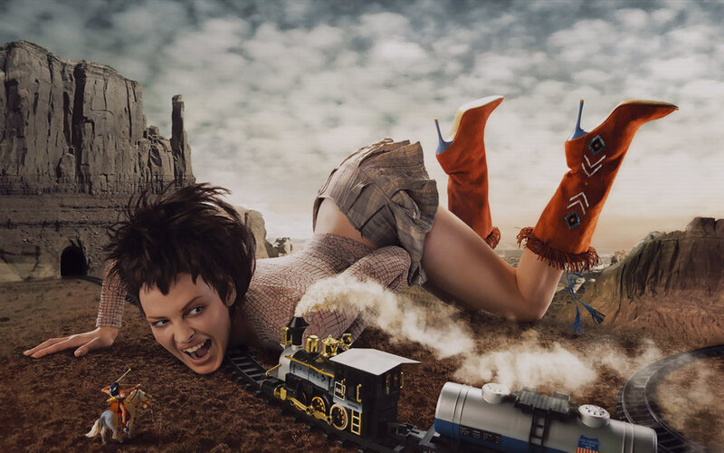 woman in desert with toy train