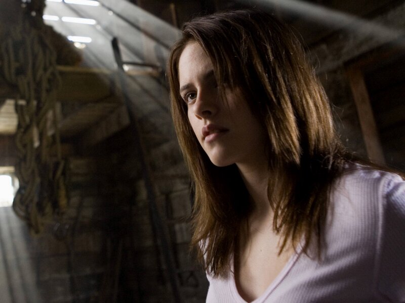 woman in dimly lit room