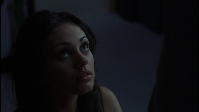 woman in dimly lit room