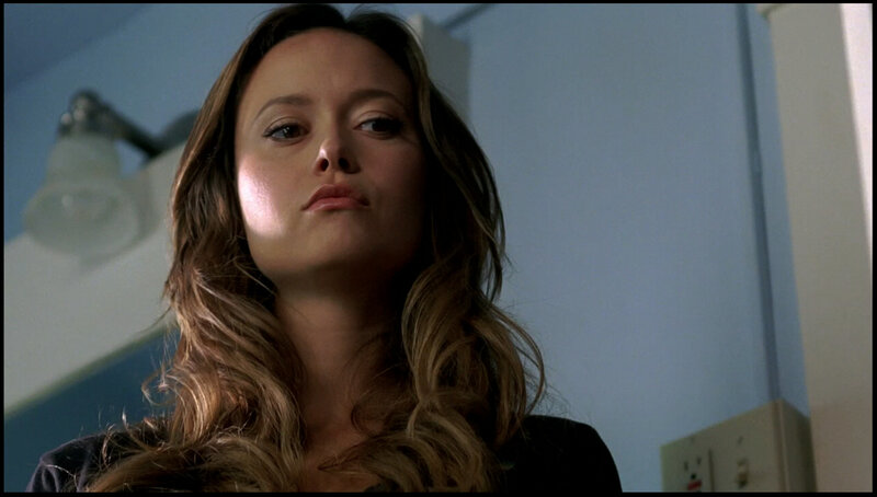 woman in dimly lit room