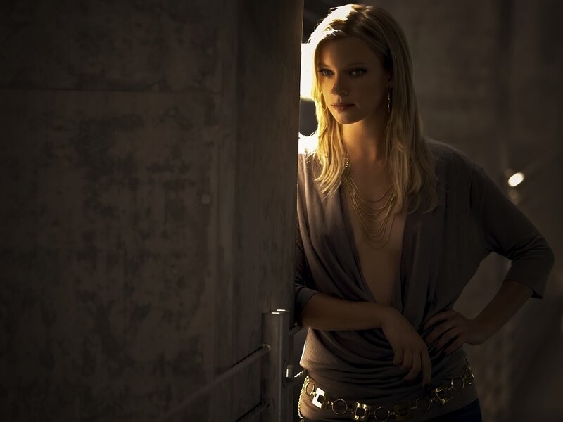 woman in dimly lit room