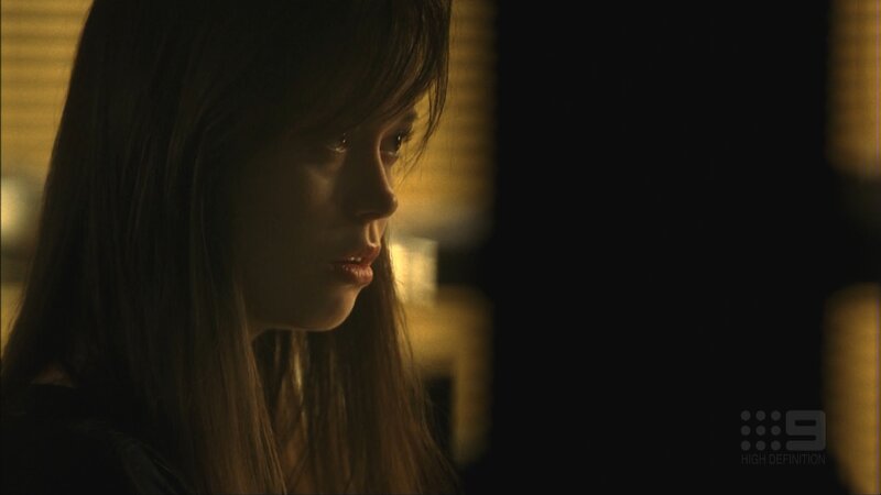 woman in dimly lit room