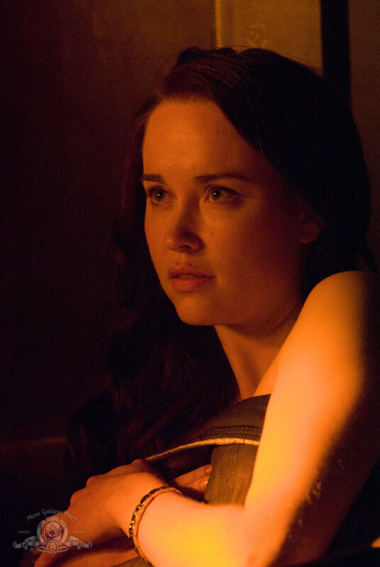 woman in dimly lit room