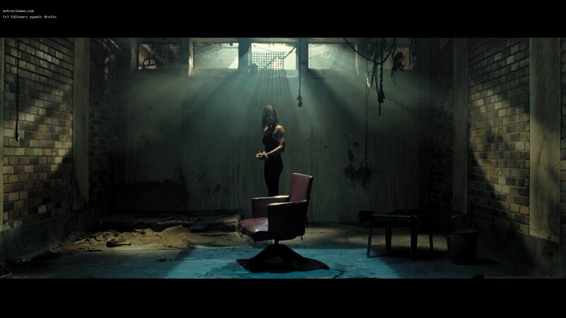 woman in dimly lit room