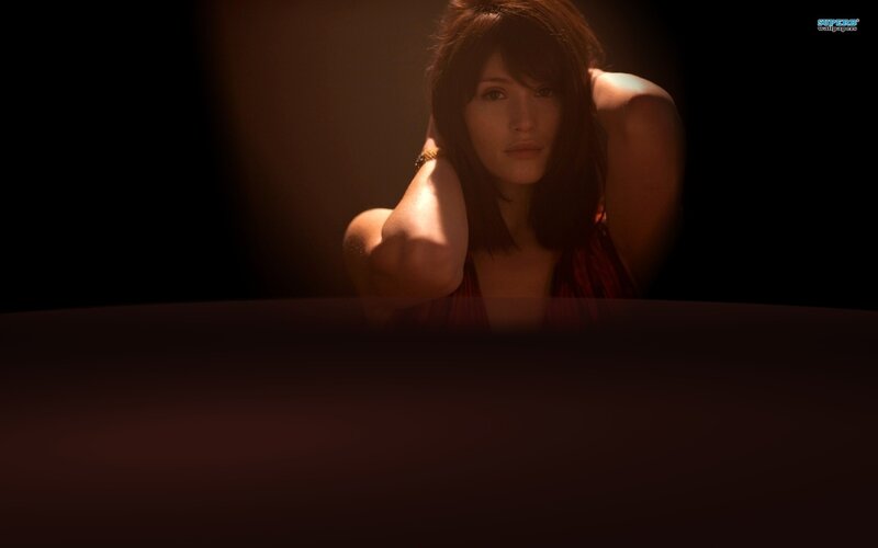 woman in dimly lit room