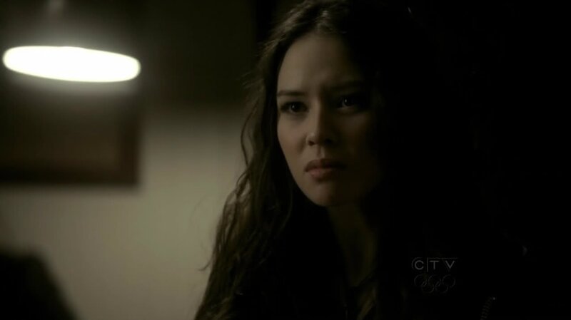 woman in dimly lit room