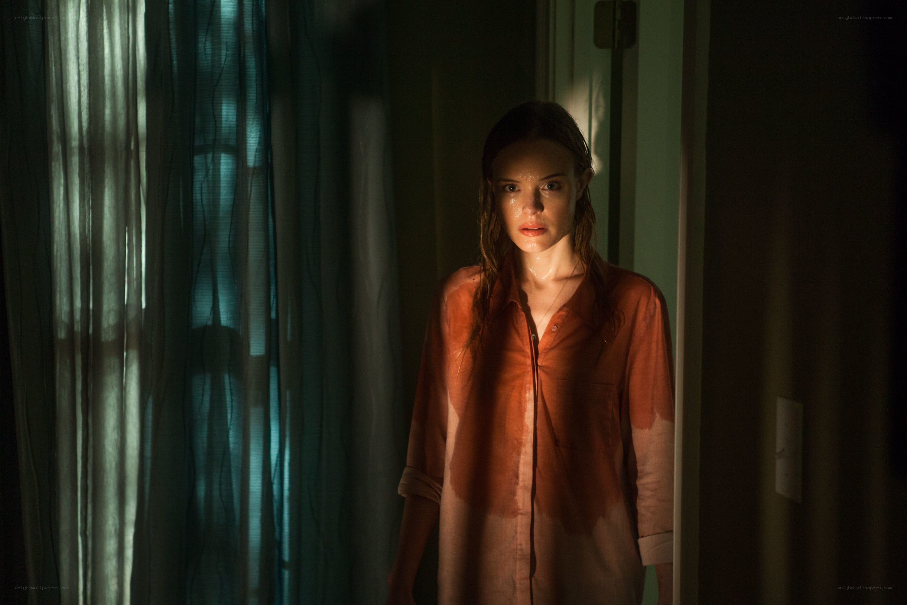 woman in dimly lit room
