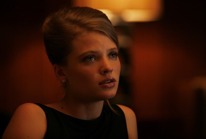 woman in dimly lit room