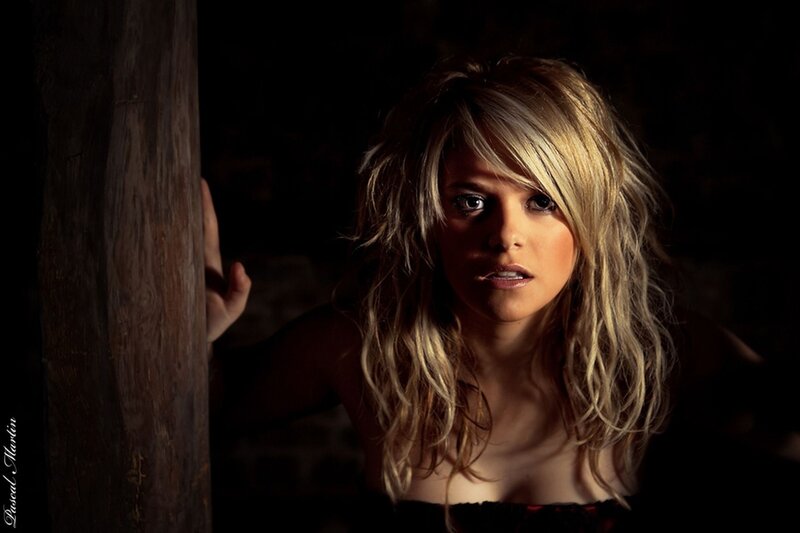 woman in dimly lit room