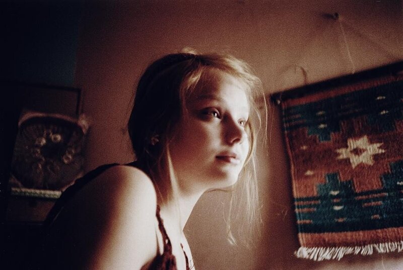 woman in dimly lit room