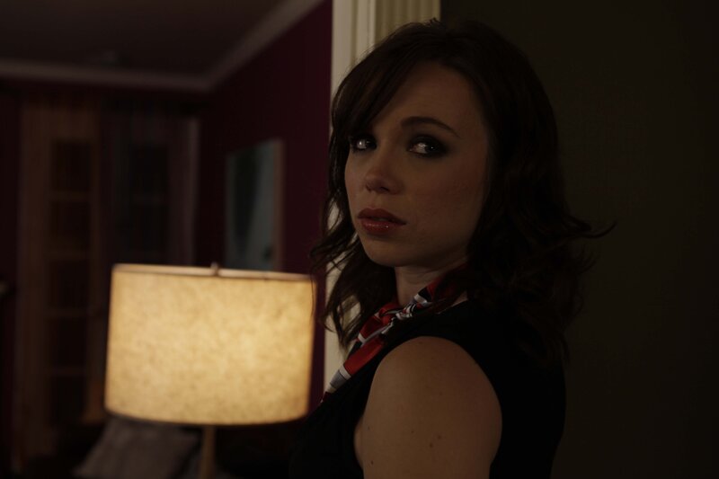 woman in dimly lit room