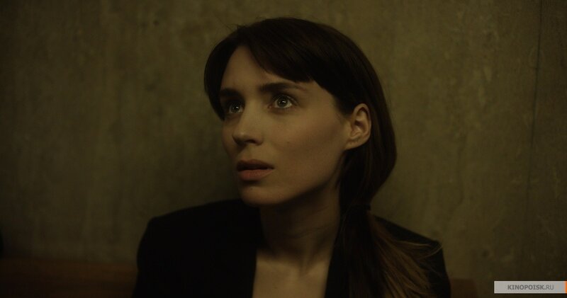woman in dimly lit room
