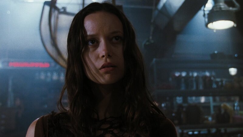 woman in dimly lit room