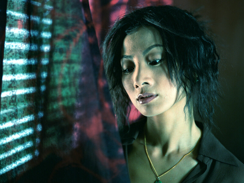 woman in dimly lit room
