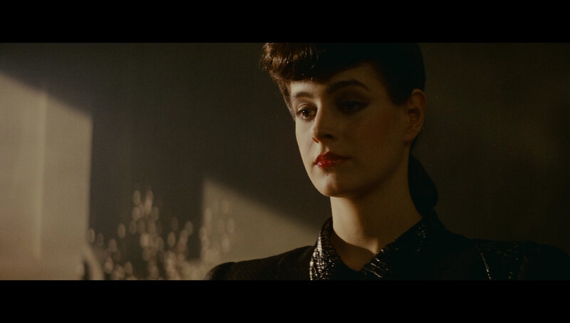 woman in dimly lit room