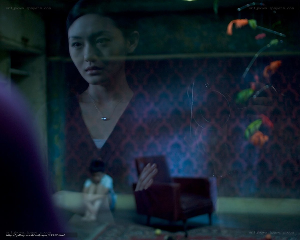 woman in dimly lit room