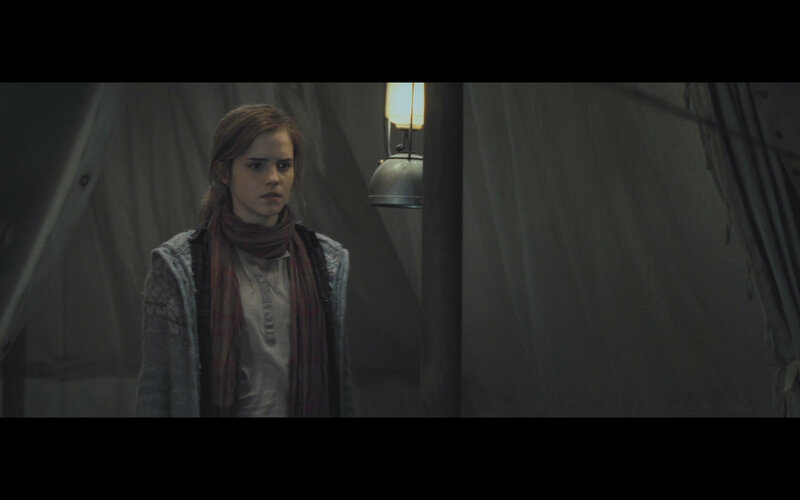 woman in dimly lit tent