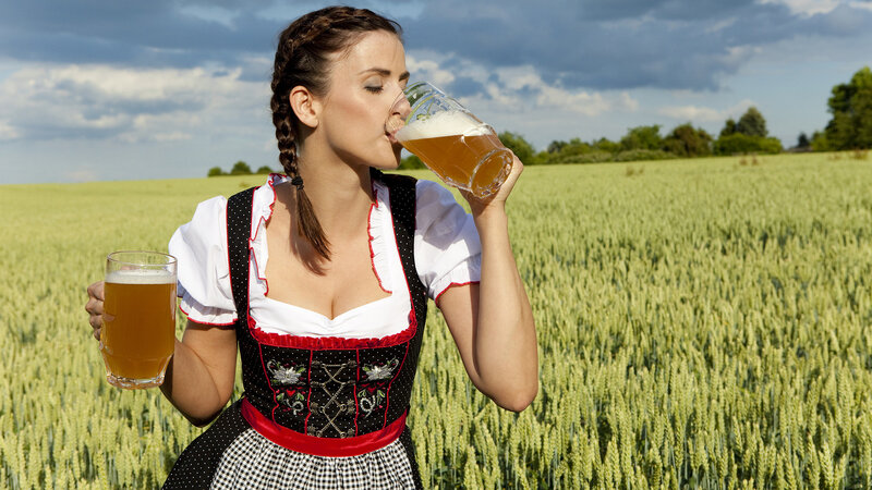 Woman in Dirndl Drinking Beer — Green