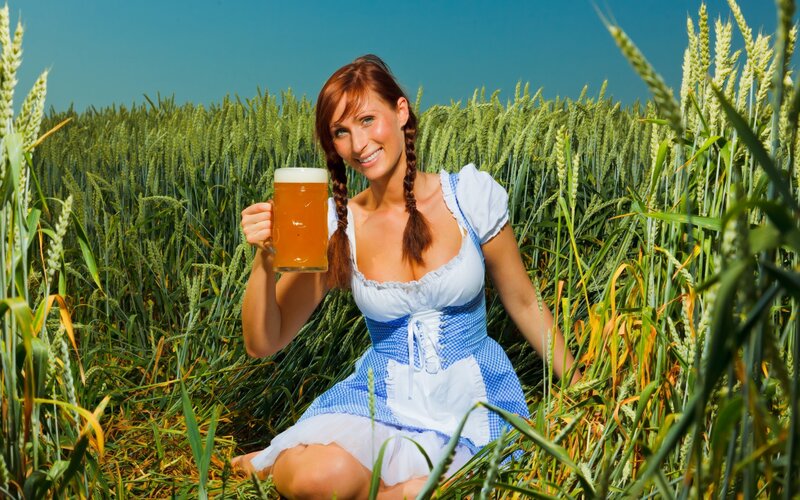 Woman in Dirndl Holding Beer — Green