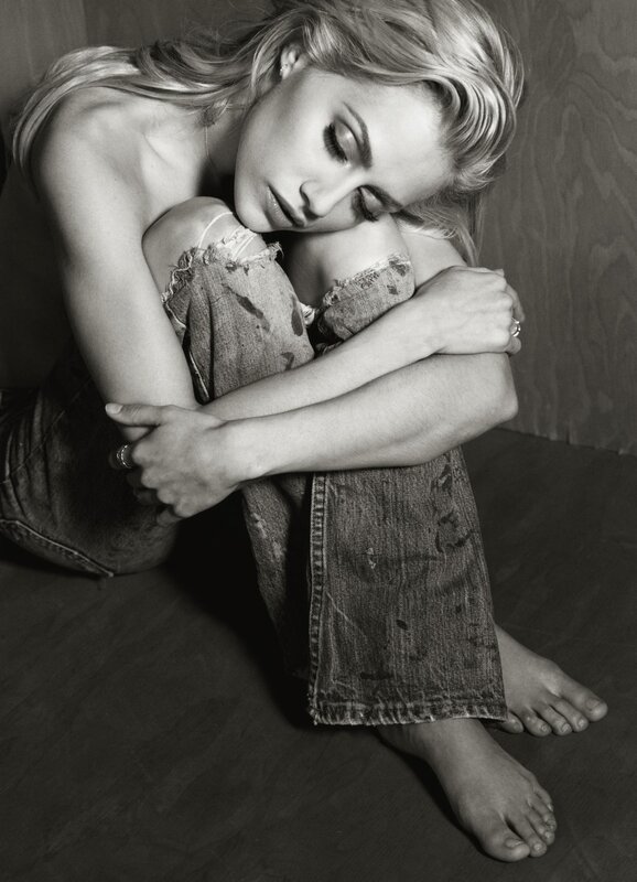 woman in distressed jeans