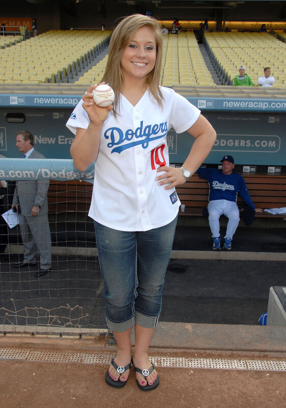 Woman in Dodgers jersey at stadium