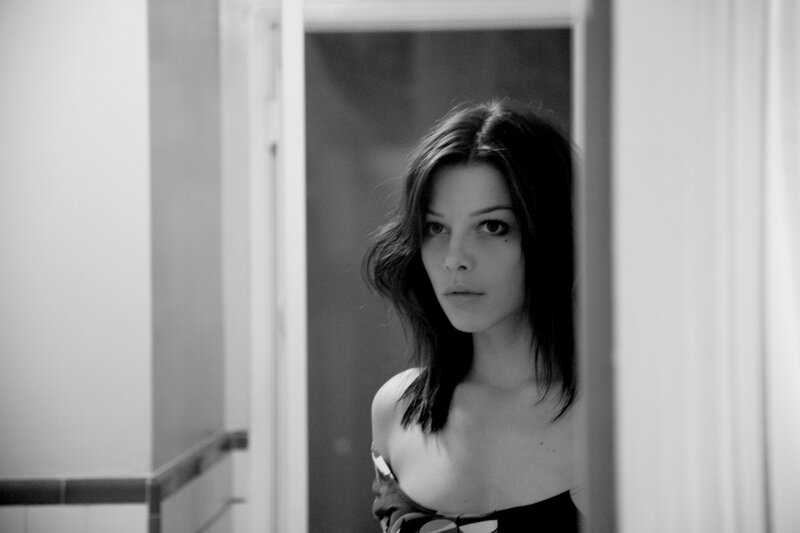 woman in doorway looking at camera