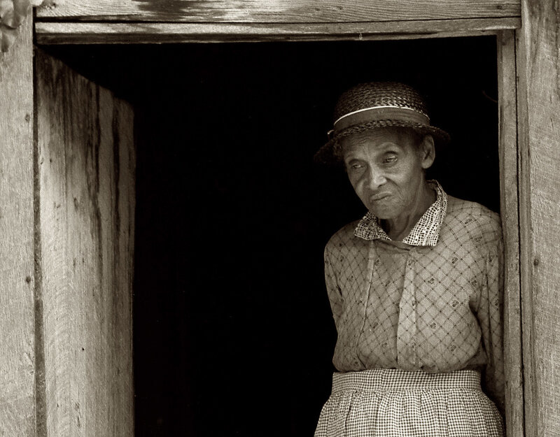 woman in doorway looking out