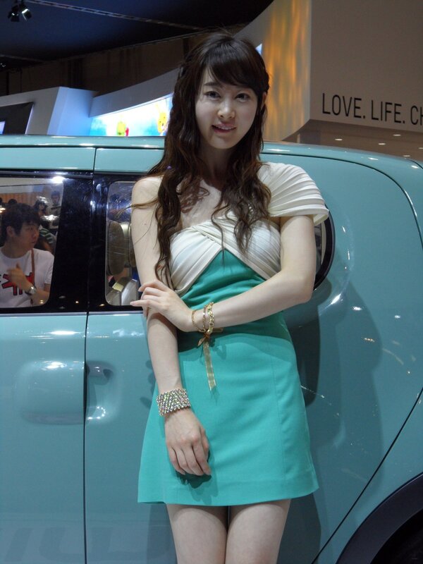 Woman in dress at car show