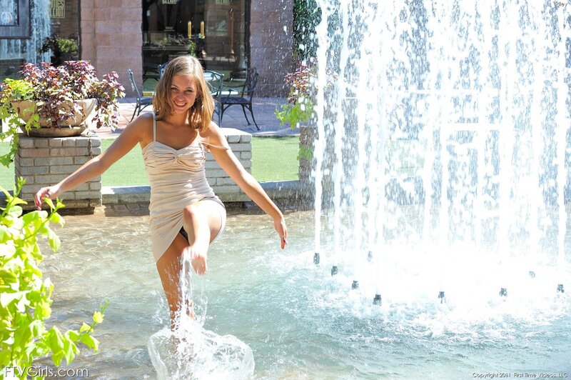 Woman in dress at fountain