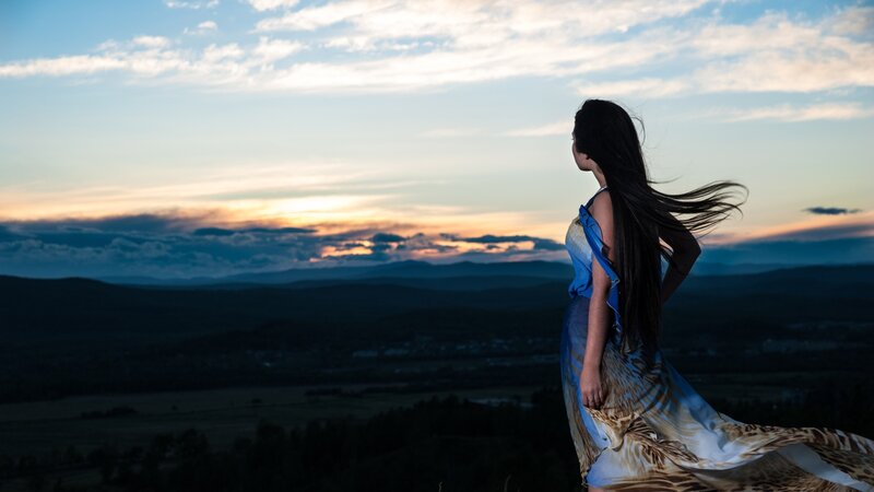Woman in dress at sunset