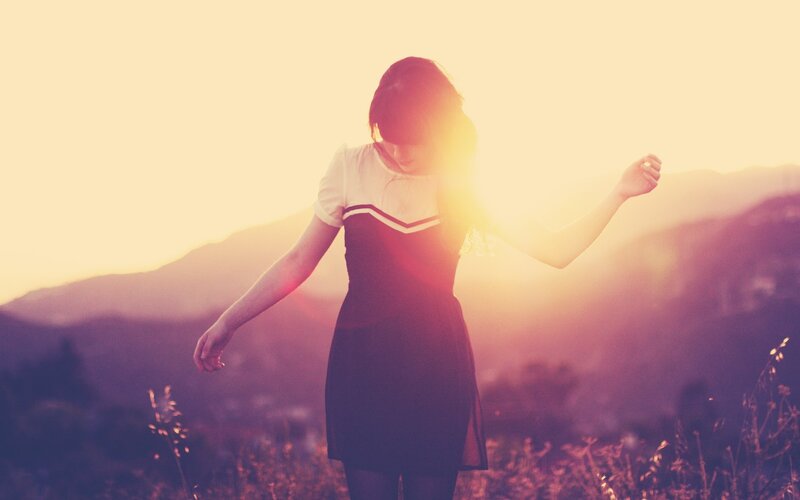 woman in dress at sunset