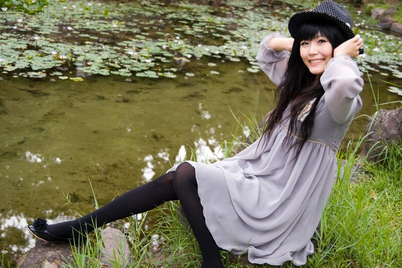 Woman in dress by pond