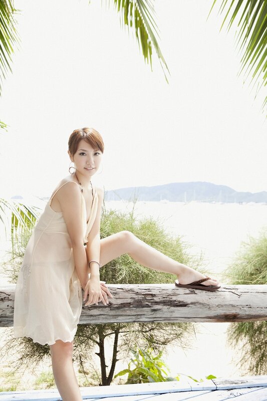 Woman in dress by the sea