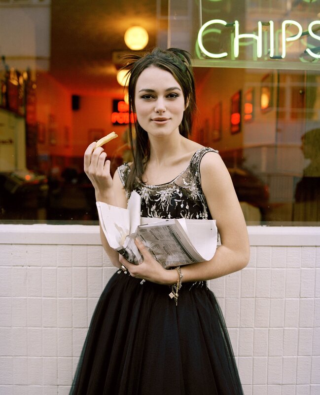 Woman in dress eating chips