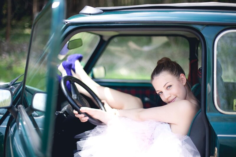 woman in dress inside car