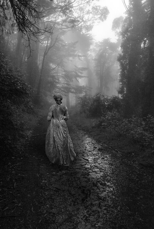 woman in dress on forest path